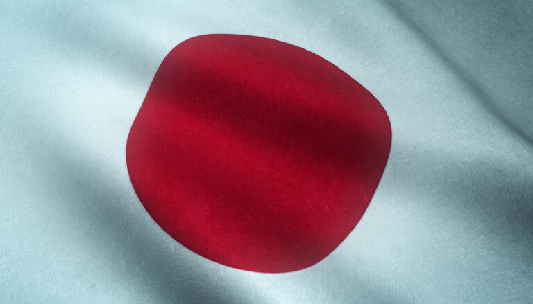 Closeup shot of the waving flag of Japan with interesting textures